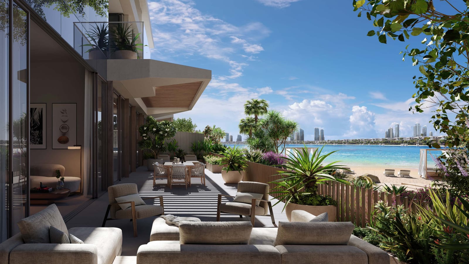 Townhouse terrace with outdoor sofas and a dining table, planting and the beach and skyline beyond