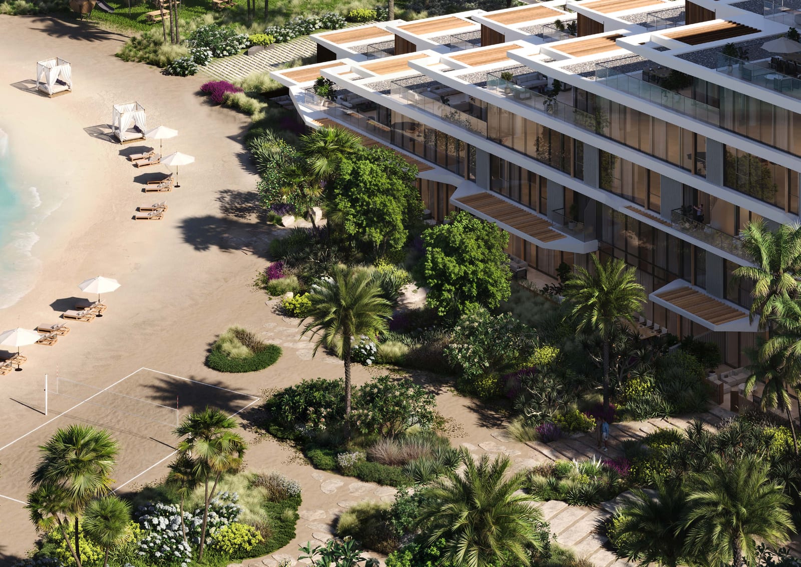 Aerial view of the lower levels of the building, gardens with palm trees and a beach with sun loungers