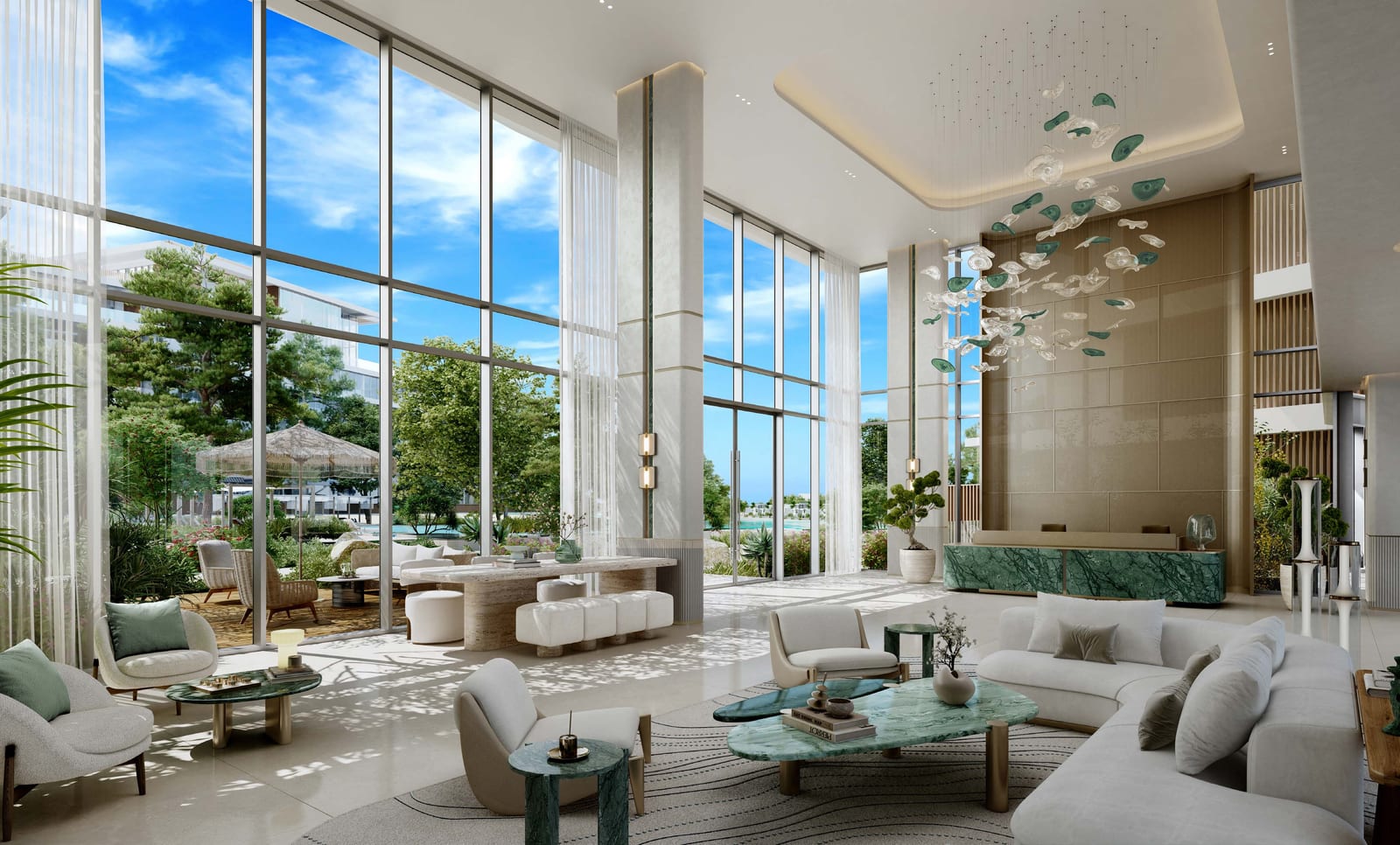 Double-height lobby with full-height windows, a sculptural ceiling light and pale sofas around low tables