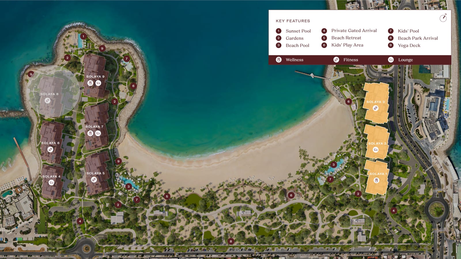 Masterplan of Solaya showing nine numbered buildings around a crescent beach, a key to the pools, gardens and arrival points, and Solaya 1 to 3 highlighted in amber on the eastern shore